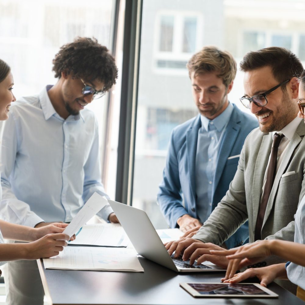 portrait-of-successful-business-team-working-in-office.jpg